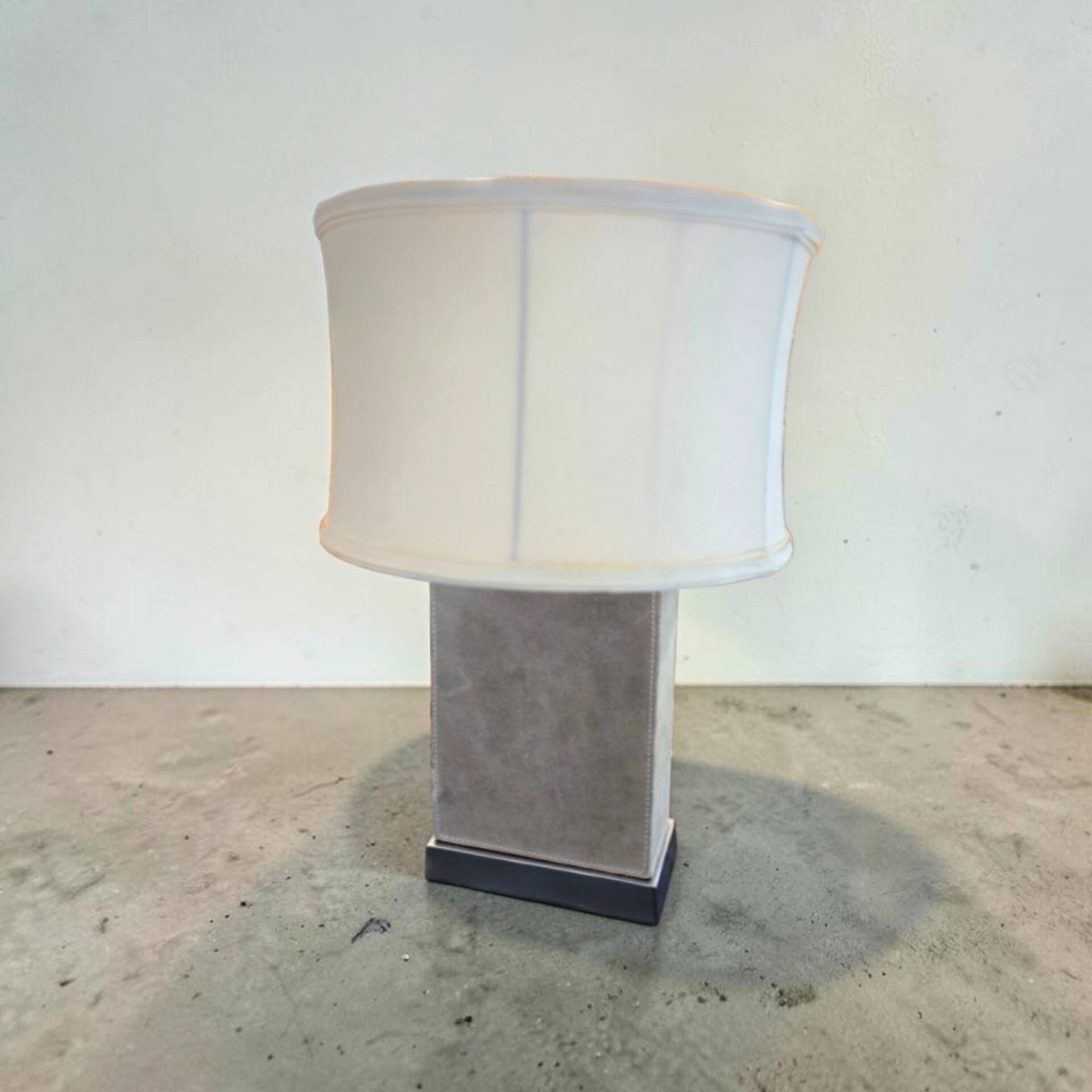 Stainless steel and suede lamp