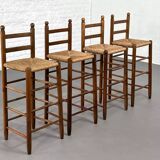 Set of 4 50s bar stools in wood and woven straw seat