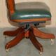Modern captain's chair in leather, beech frame, adjustable.