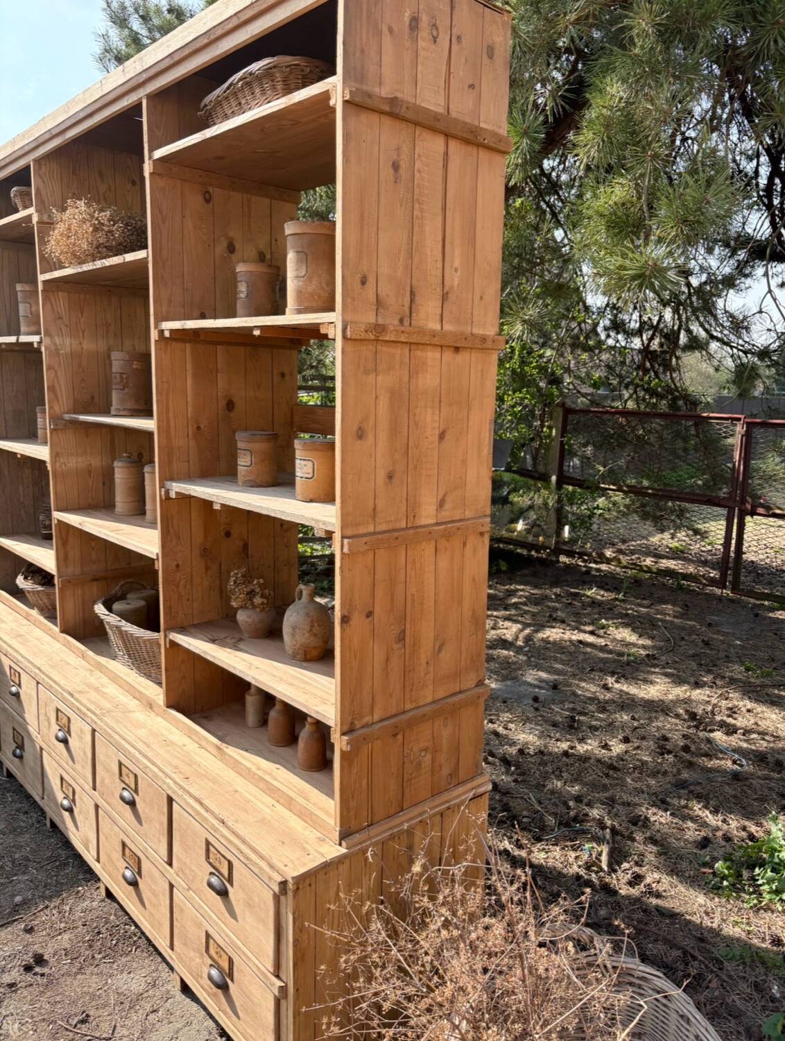 Large antique workshop furniture with drawers and shelves.