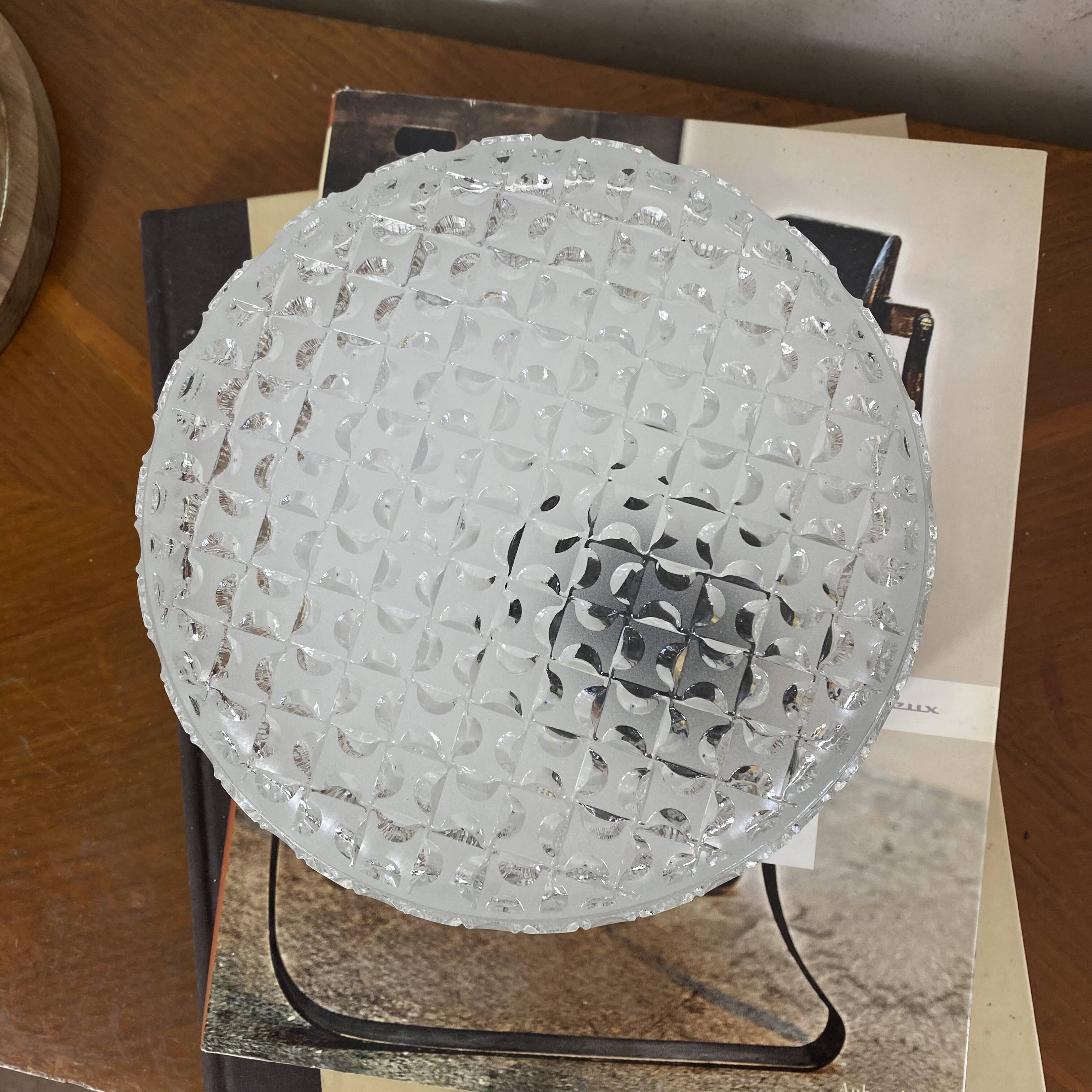 Round wall light or ceiling light with transparent glass from the 1970s.