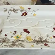Very large rectangular dish with scalloped edges, made of fine glazed earthenware.