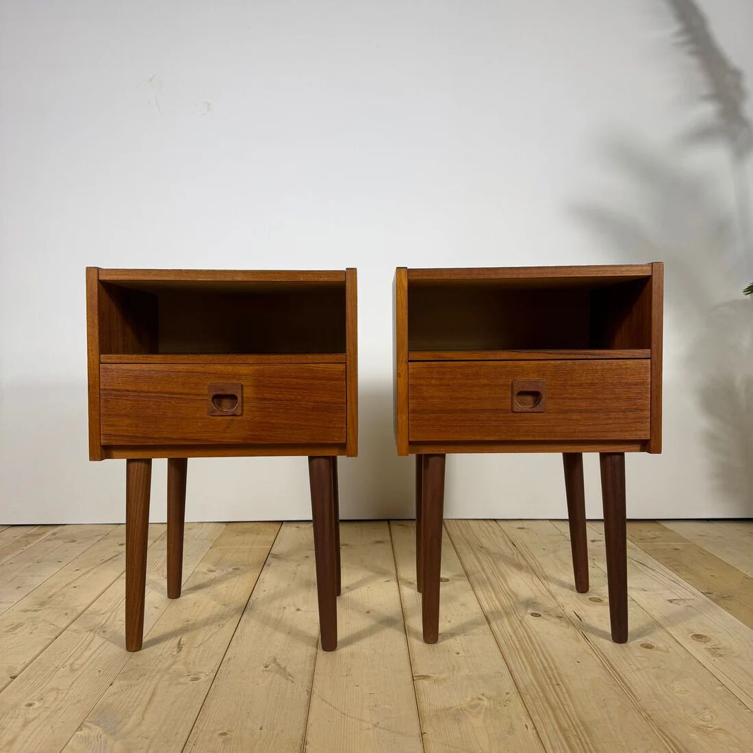 Pair of mid-century modern teak bedside tables with drawer.