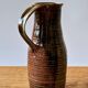 Vintage enameled stoneware pitcher