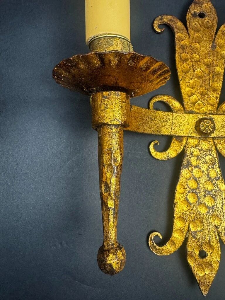 Pair of electrified golden wrought iron gothic wall sconces.