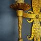 Pair of electrified golden wrought iron gothic wall sconces.
