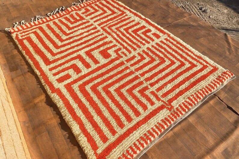 Handmade traditional orange and white Beni Ourain rug.