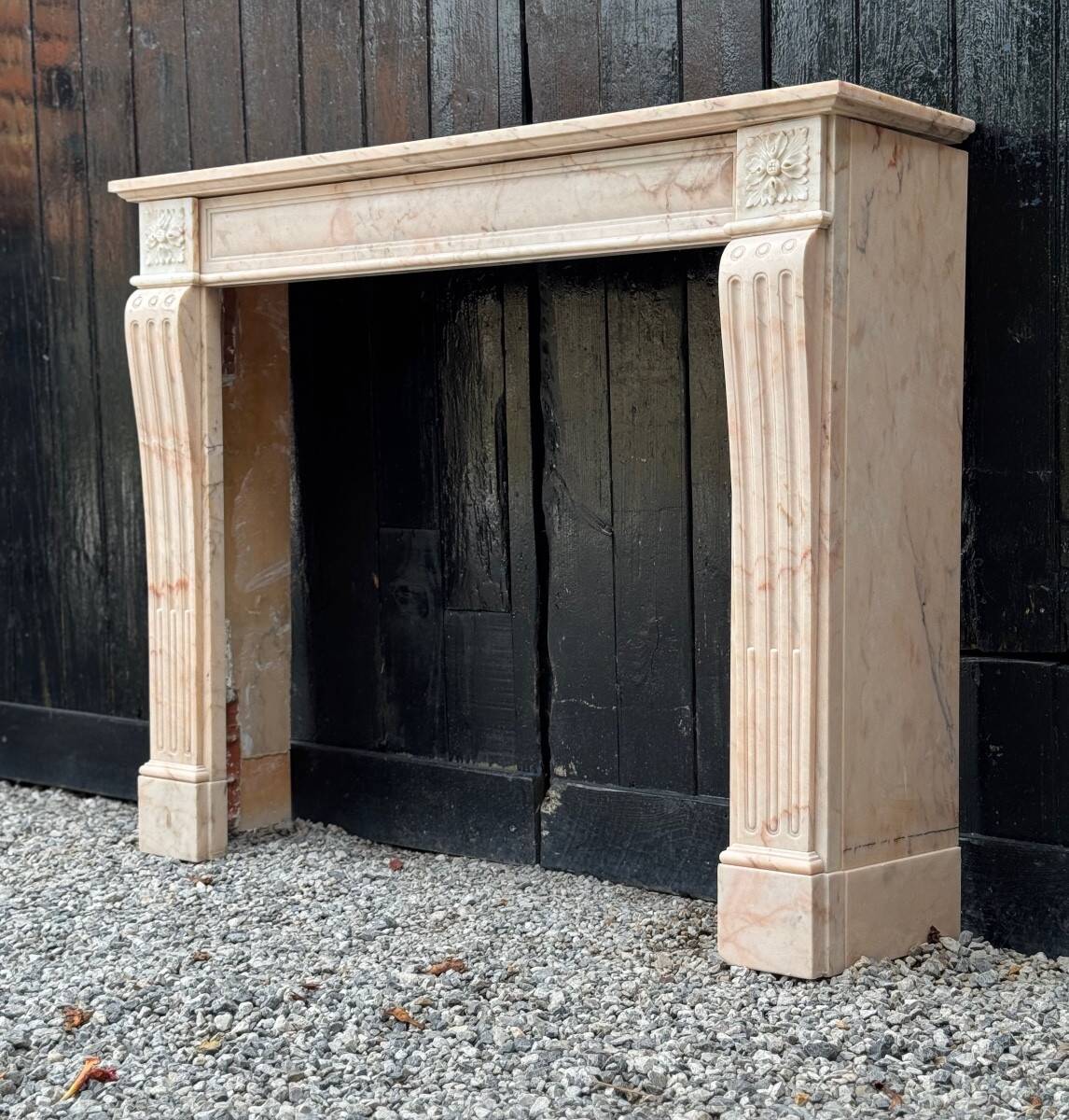 Louis XVI style fireplace in pink marble, circa 1920