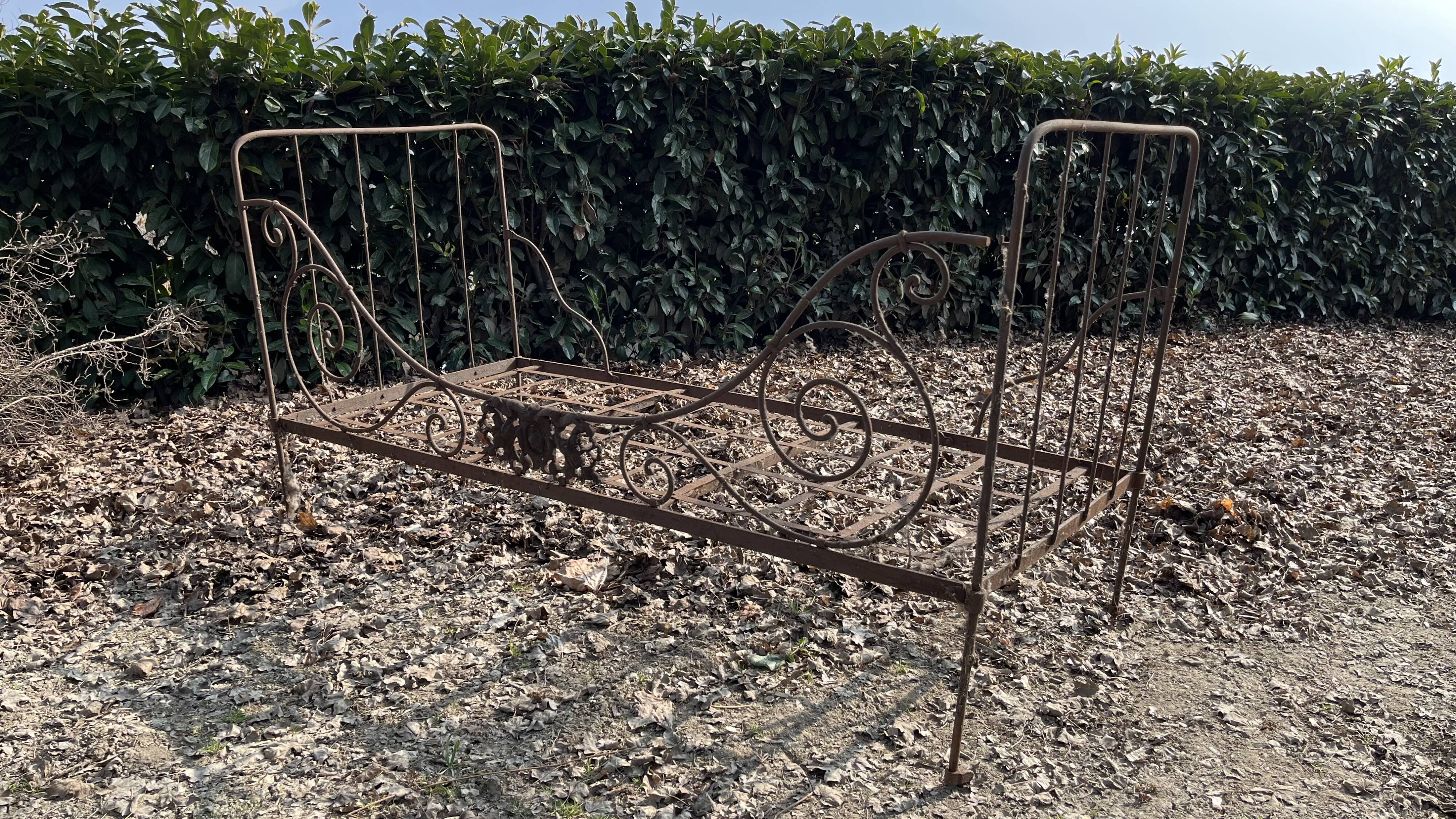 Folding wrought iron bed 1900