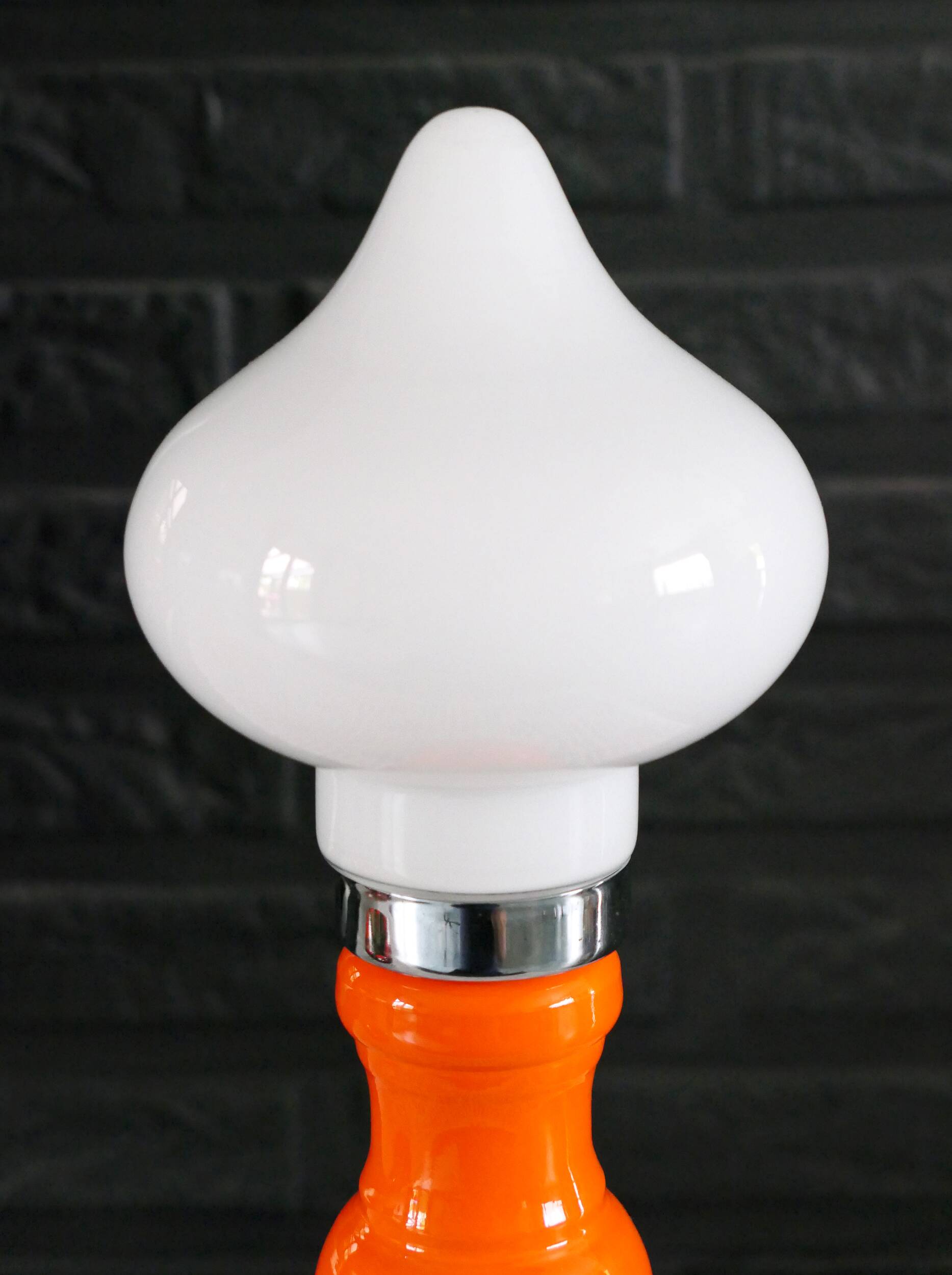 Table lamp or bedside lamp from the 1960s-70s in orange and chrome.