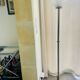 Brass floor lamp with a round glass globe