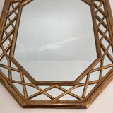 Octagonal mirror in gilded wood with closed guards