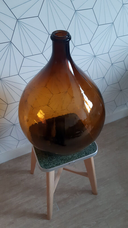Great old demijohn in amber glass