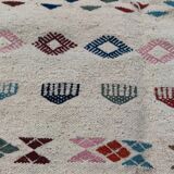 White margoum carpet with multicolored Berber patterns