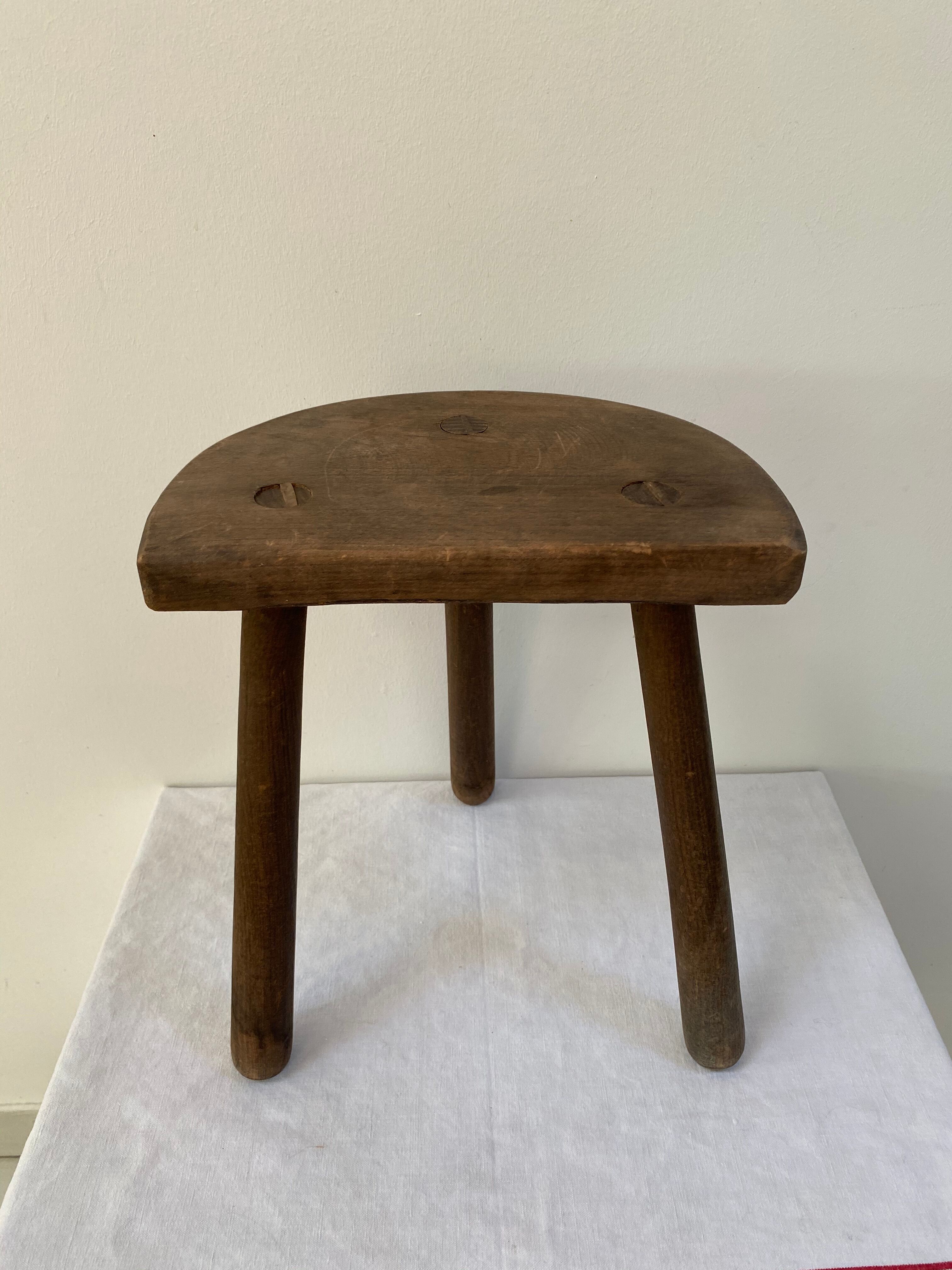 Old wooden tripod stool