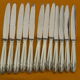 Set of 12 cheese or fruit knives handle in silver metal.
