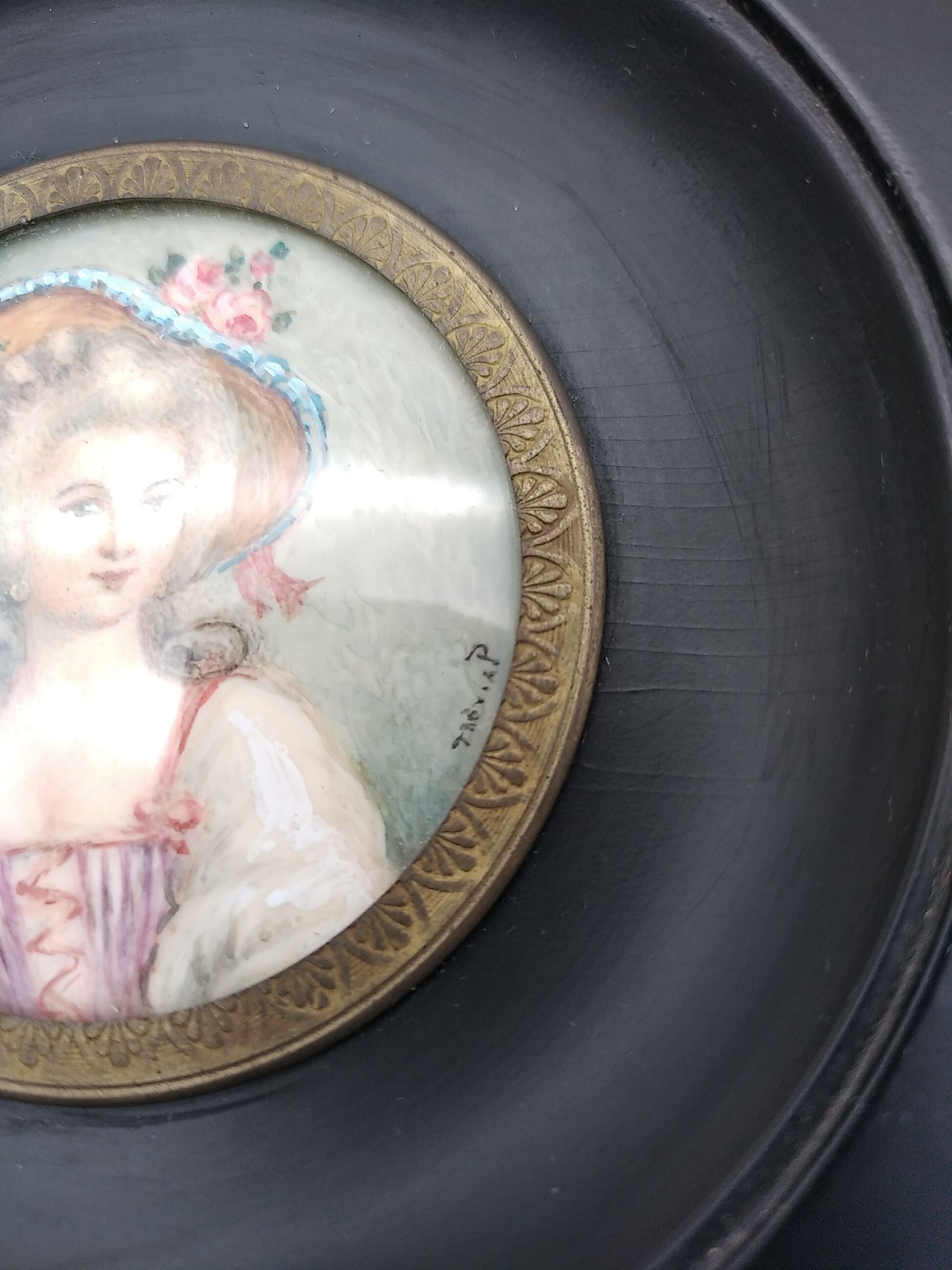 Miniature on ivory. Young woman with a flowery hat