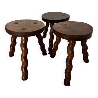 Wooden tripod stool with twisted legs