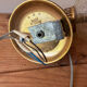 Pair of vintage wall sconces with golden metal swan heads and glass.