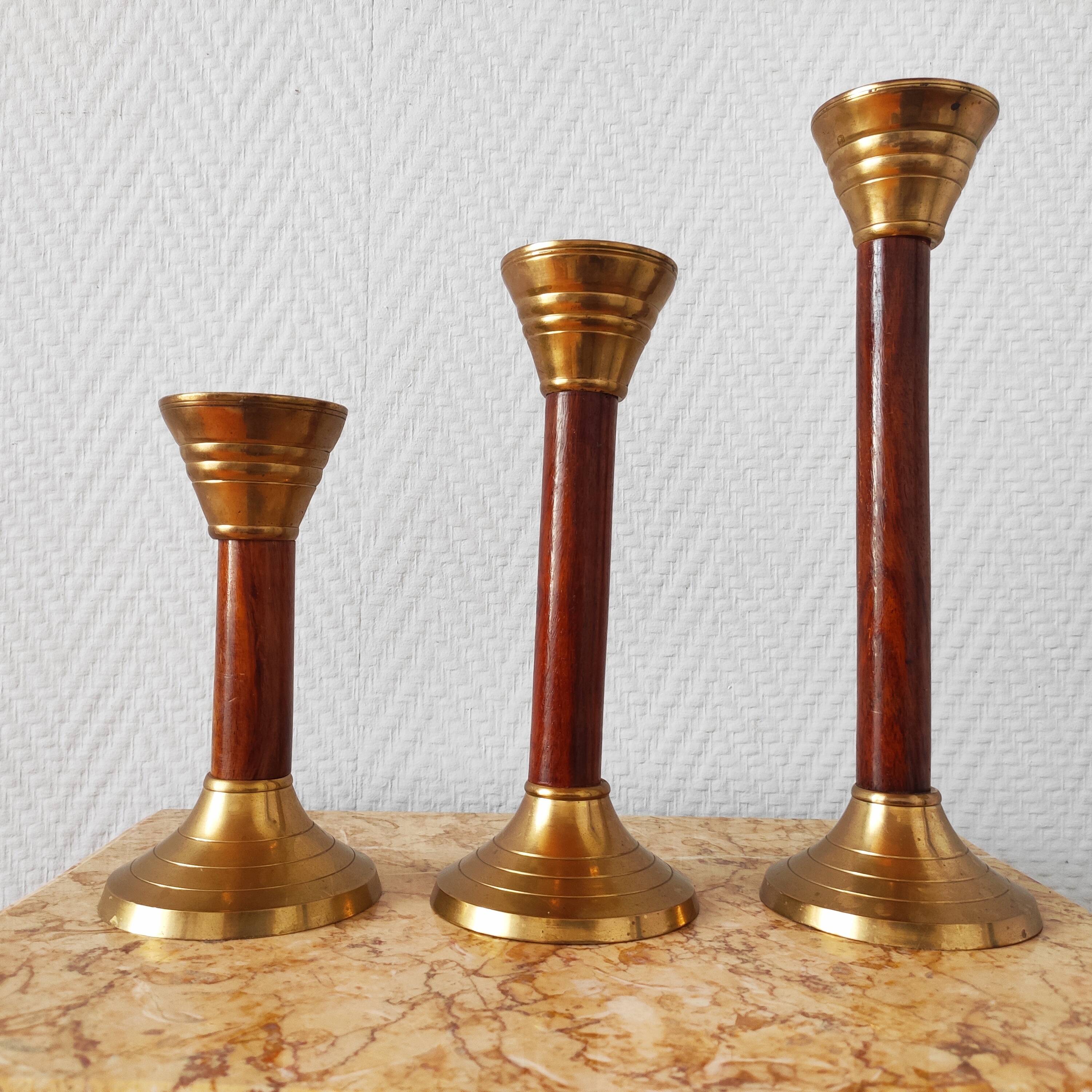 Set of three vintage wooden and brass candlesticks