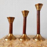 Set of three vintage wooden and brass candlesticks