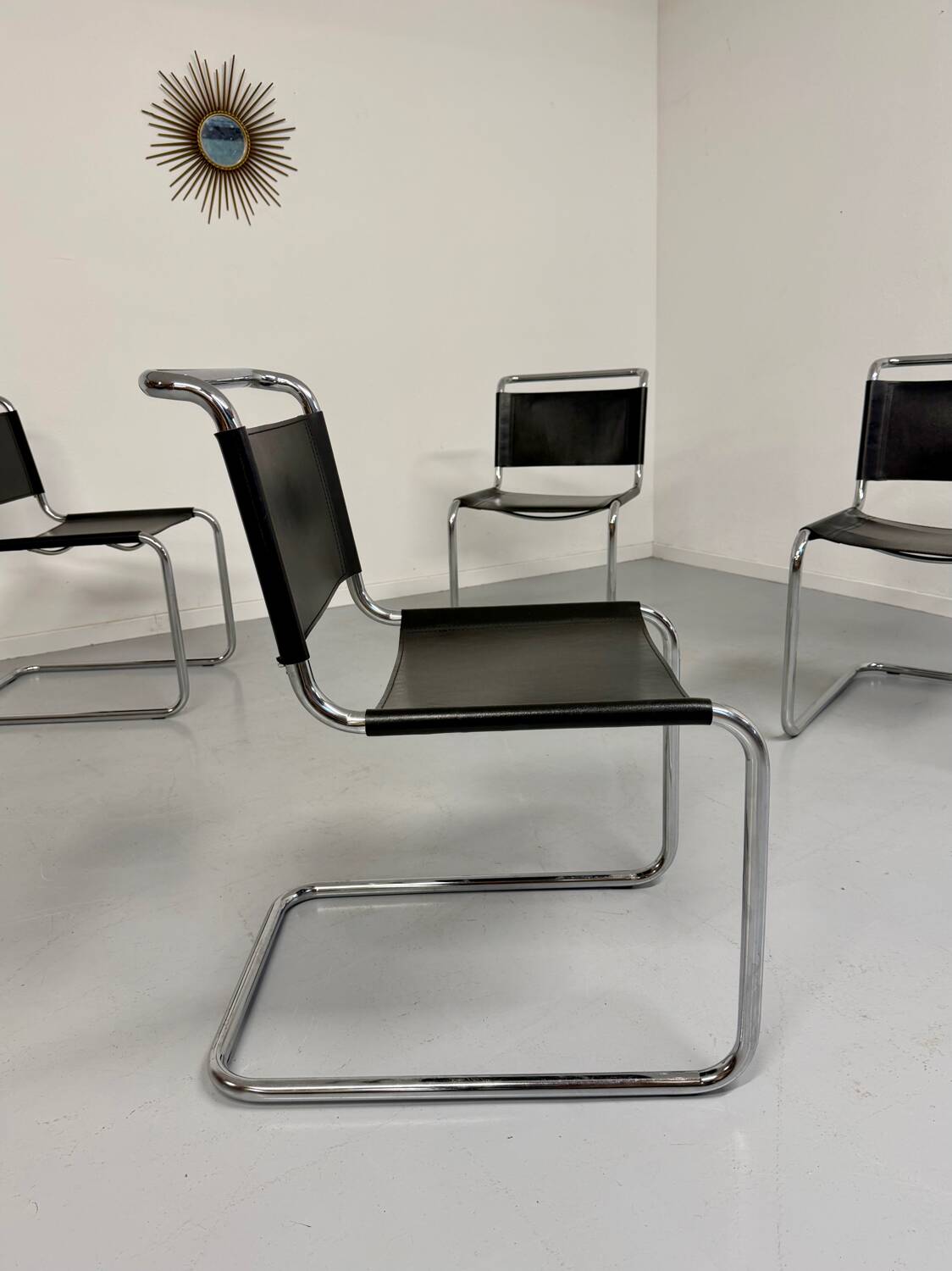 Lot of 4 tubular chairs designed by Mart Stam in vintage black leather from the 1980s.
