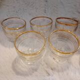 7 vintage mini shot glasses.