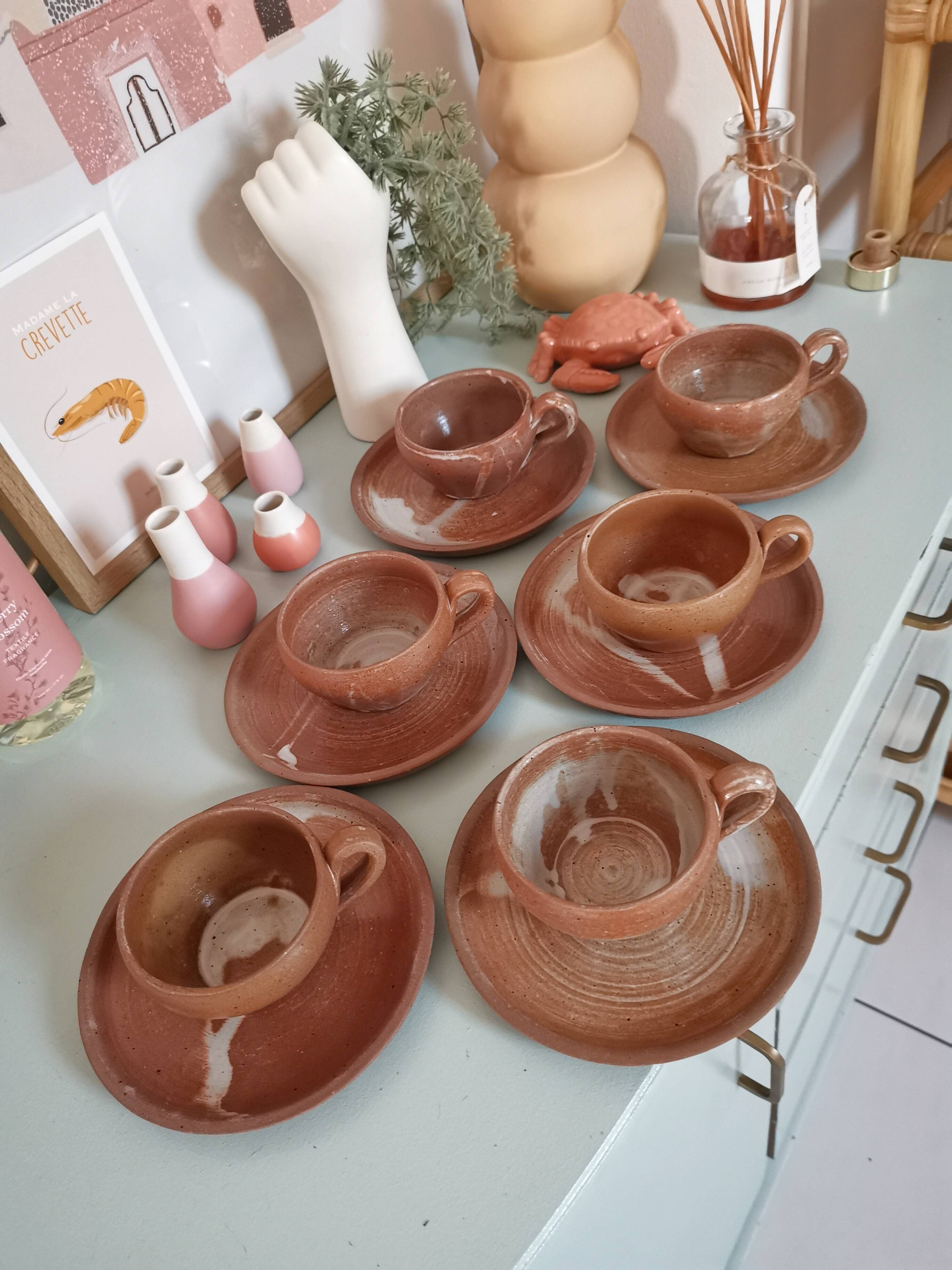 Set of vintage stoneware cups and saucers