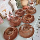 Set of vintage stoneware cups and saucers