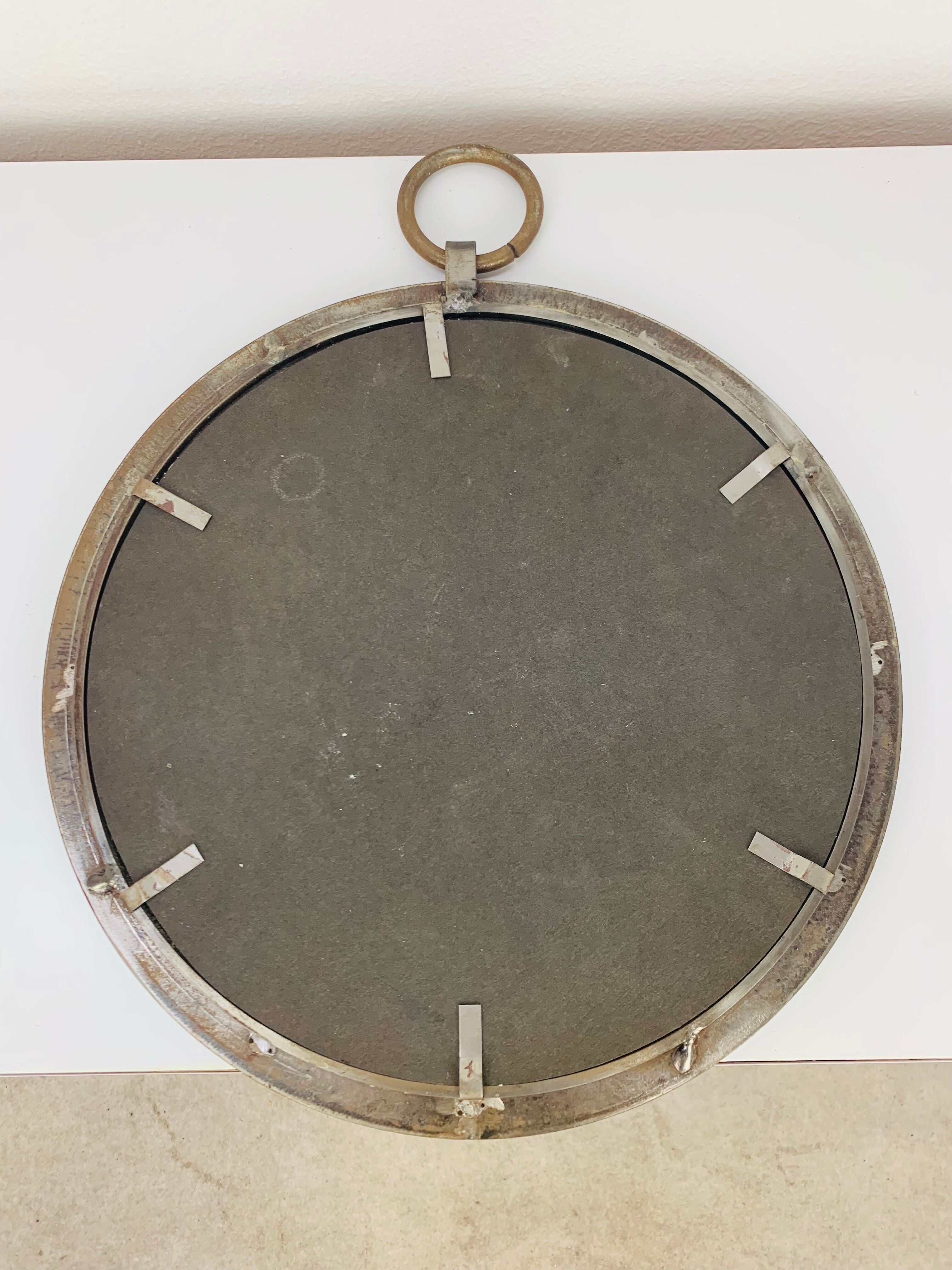 Round wrought iron porthole mirror