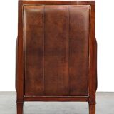 Comfortable Art Deco design armchair in cognac-colored sheepskin combined with wood