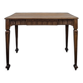 Neo-Gothic writing table in walnut with an arcature frieze.