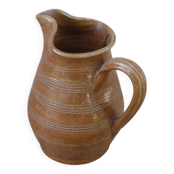 Old stoneware wine jug with patterns