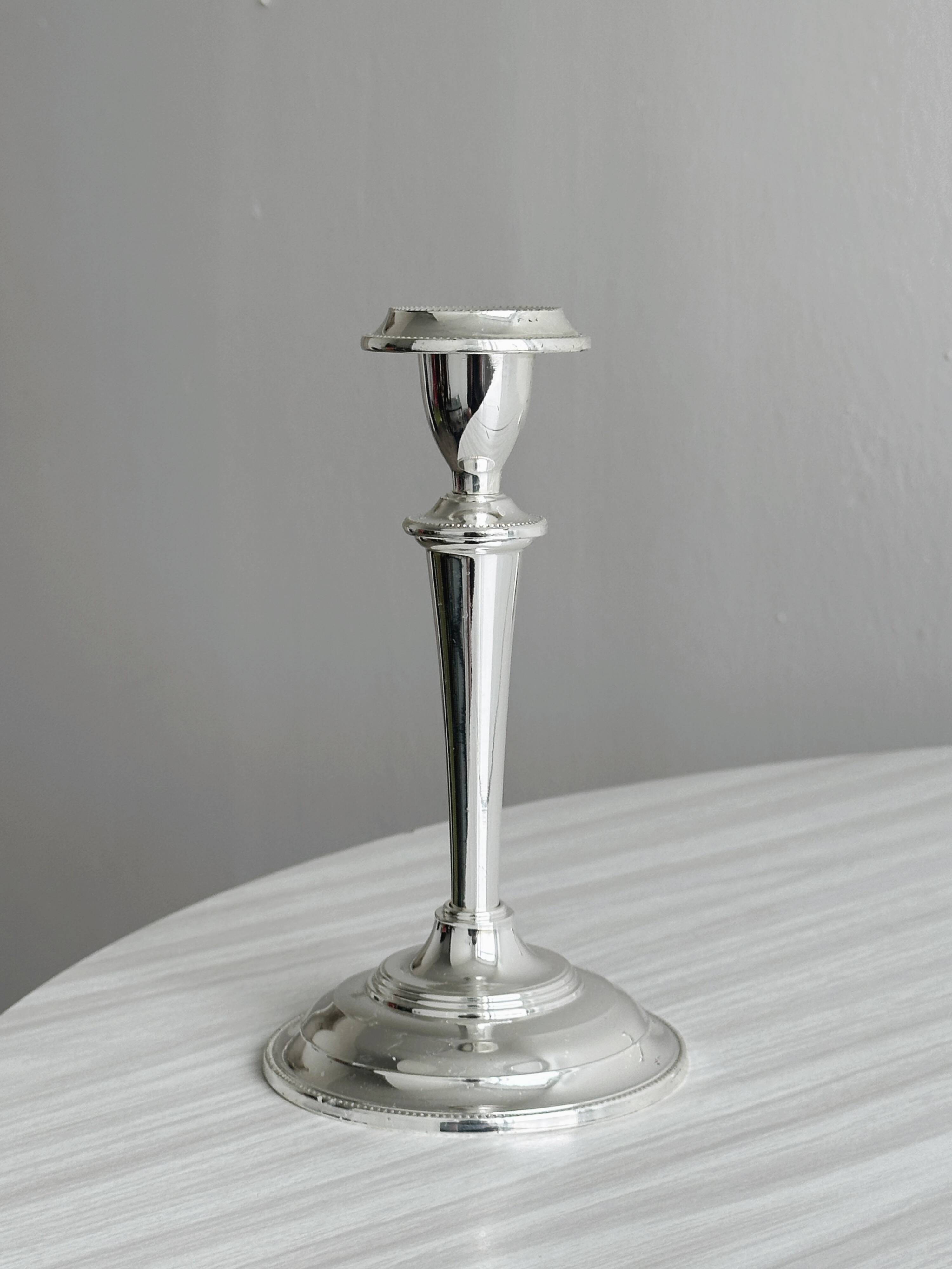 Pair of elegant stainless steel candlesticks