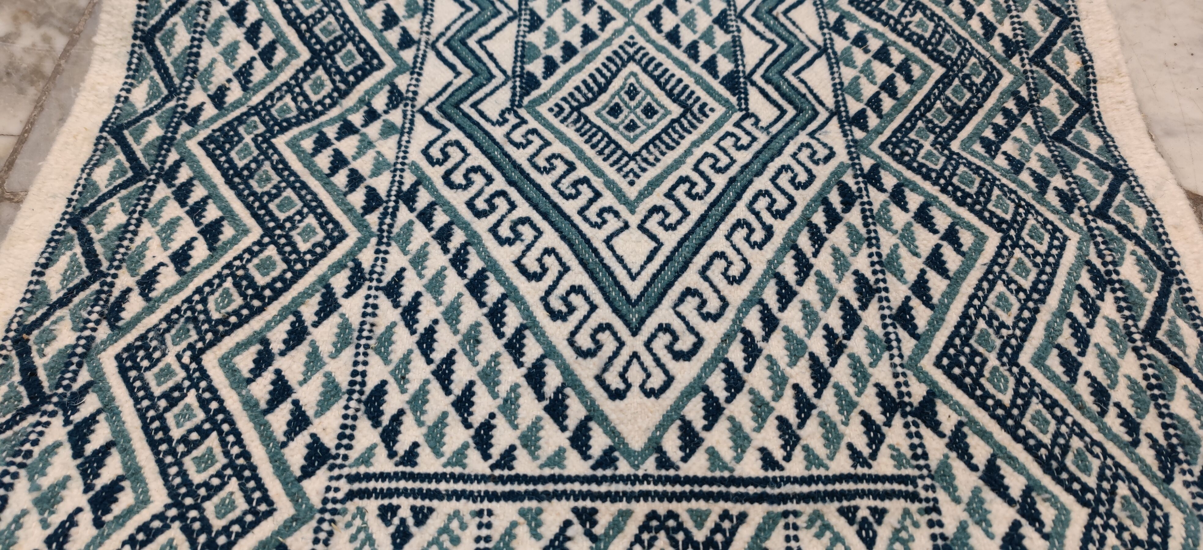 Handmade traditional white and blue carpet, 152x76 cm