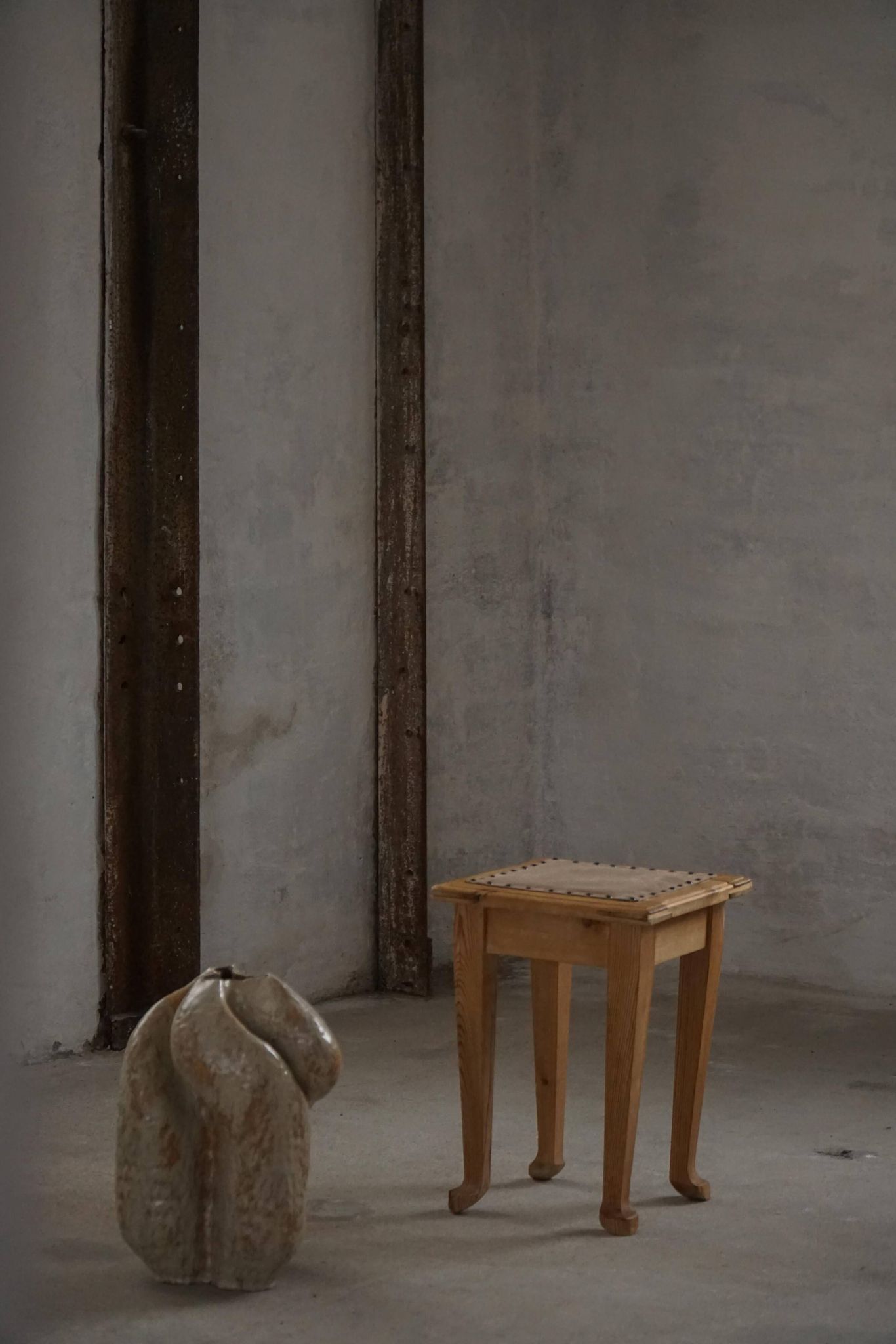A pair of antique Danish pine stools from the late 19th century.