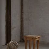 A pair of antique Danish pine stools from the late 19th century.
