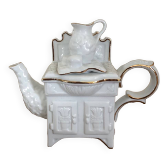 Original mini teapot fooled by the eye in the shape of a piece of furniture