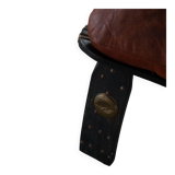 Dark red upholstered camel saddle stool, 20th century, North Africa.