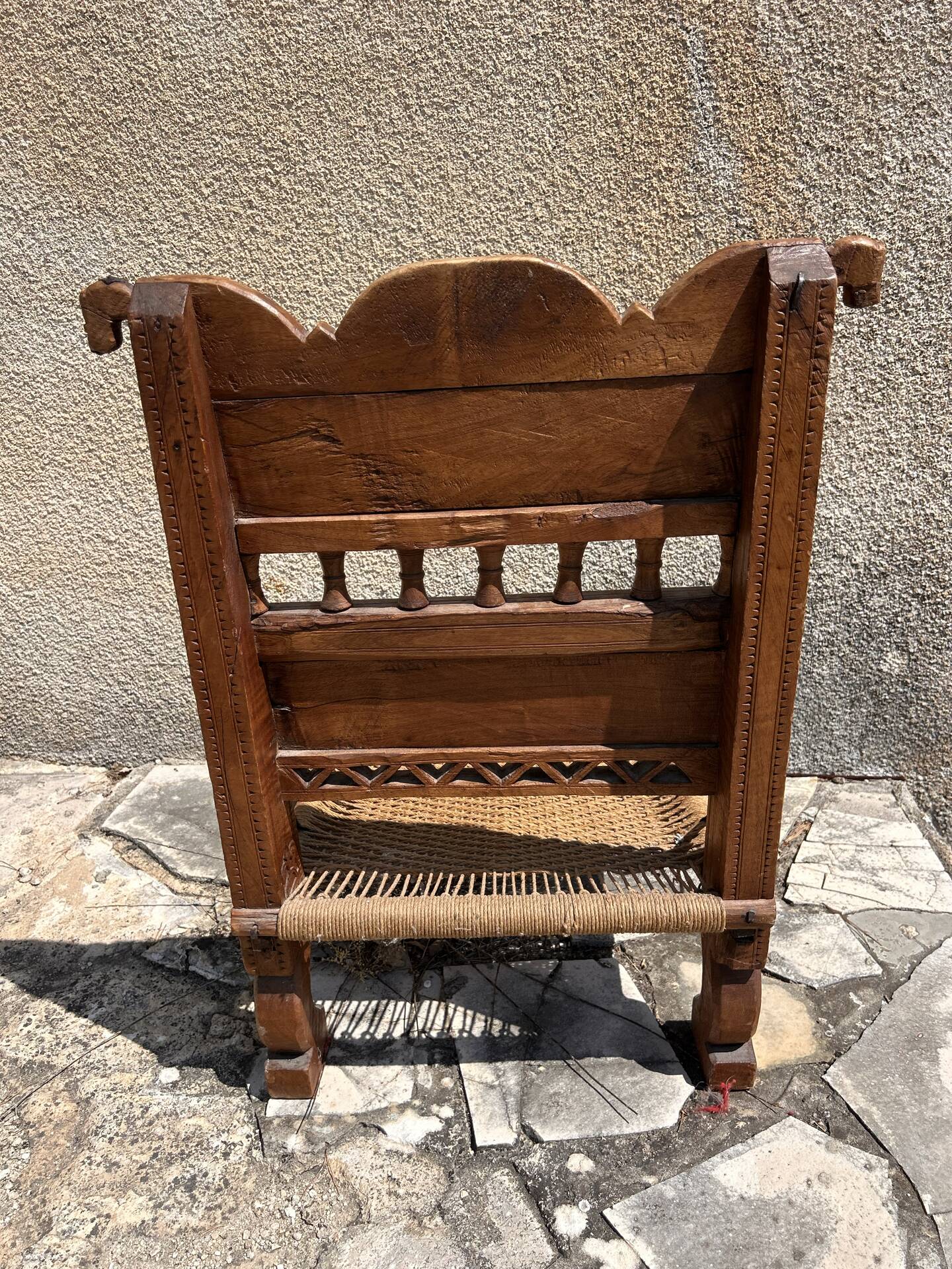 Antique ethnic chair in carved wood