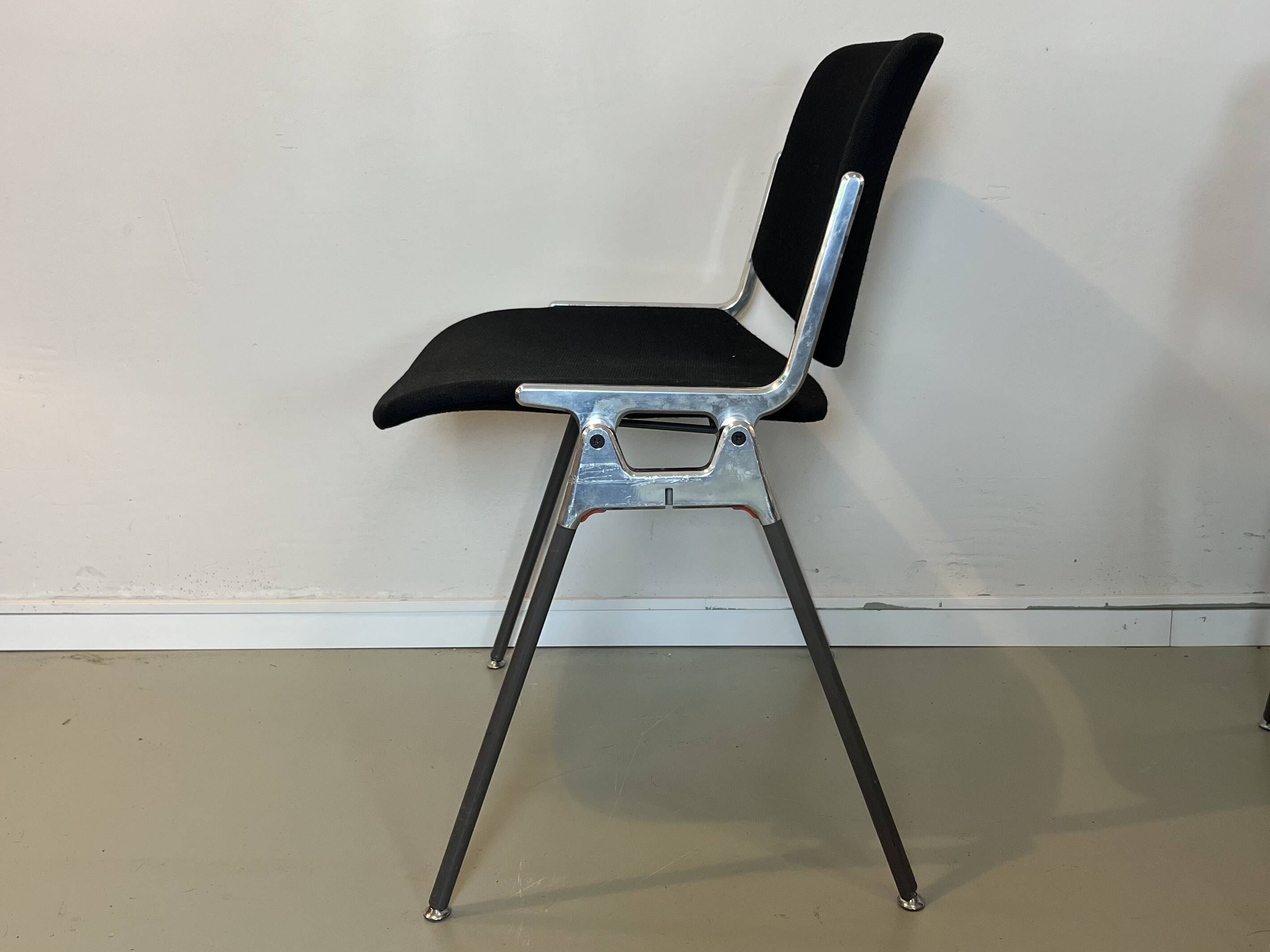 Black DSC chairs by Giancarlo Piretti for Castelli from the 60s/70s.