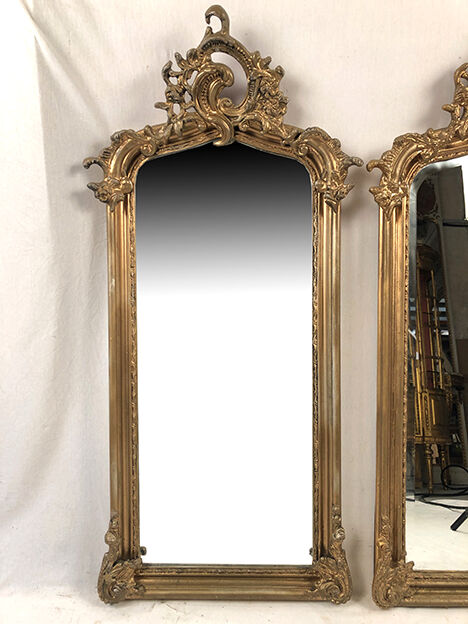 Pair of Louis XV style mirrors, stuccoed and gilded wood, beveled mirrors