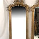 Pair of Louis XV style mirrors, stuccoed and gilded wood, beveled mirrors
