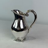 Water jug on feet decorated with ebony of hallmarked silver from the 1940s. The jug is in great anti