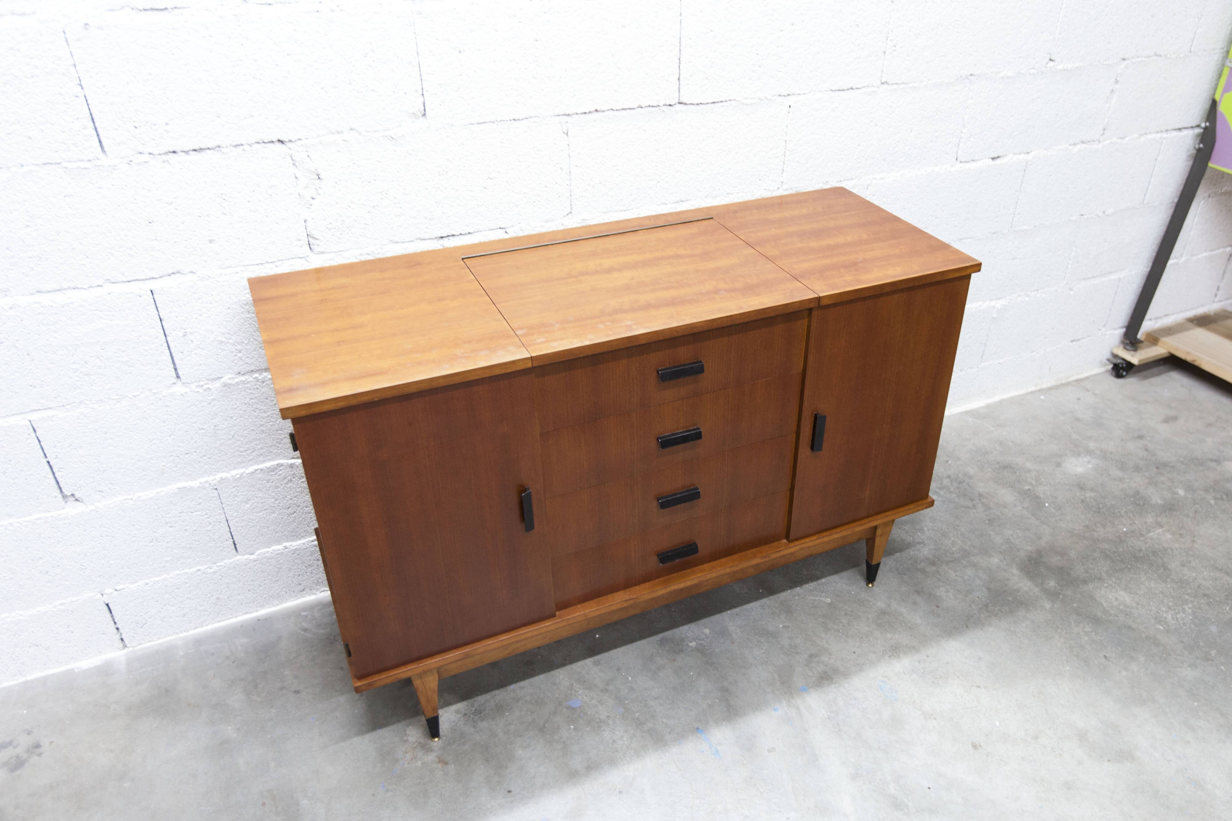 1960s teak sideboard with 4 drawers, 2 doors, and a mirror.