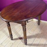 Old oval table with 2 swings