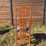 Set of 8 teak lounge chairs with high backs and zebra-striped seats