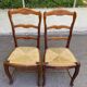 2 dining chairs with carved solid wood and rush seats in Louis XV shell style.