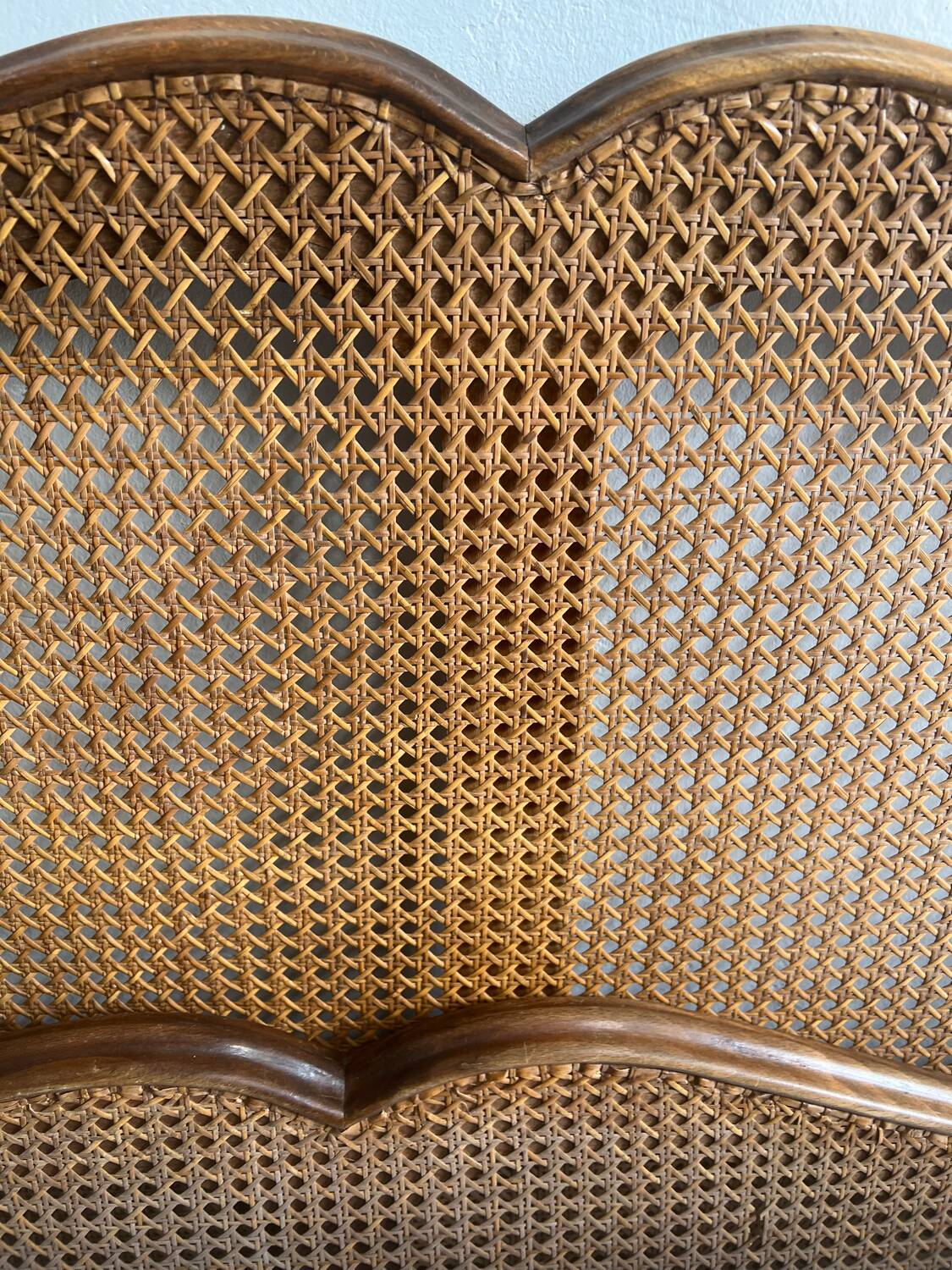 Old wooden and cane bed