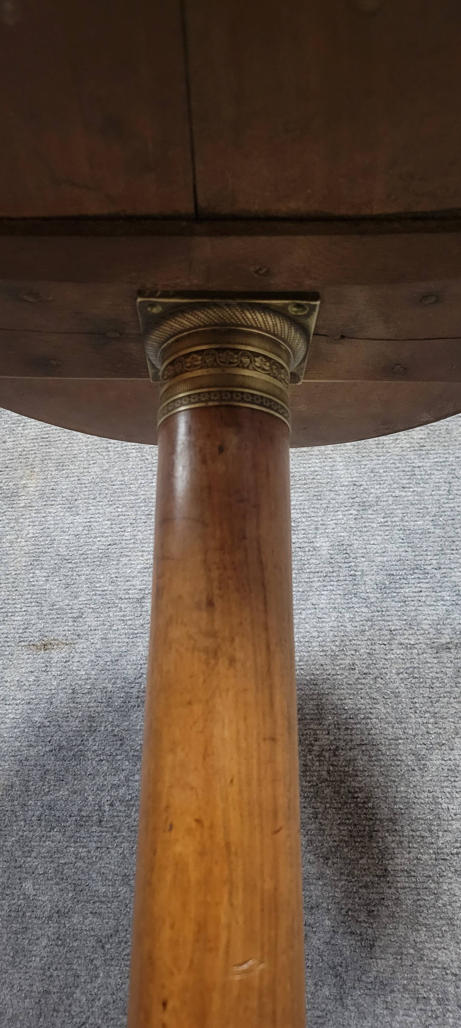 Empire period pedestal table in solid wood and gilt bronze